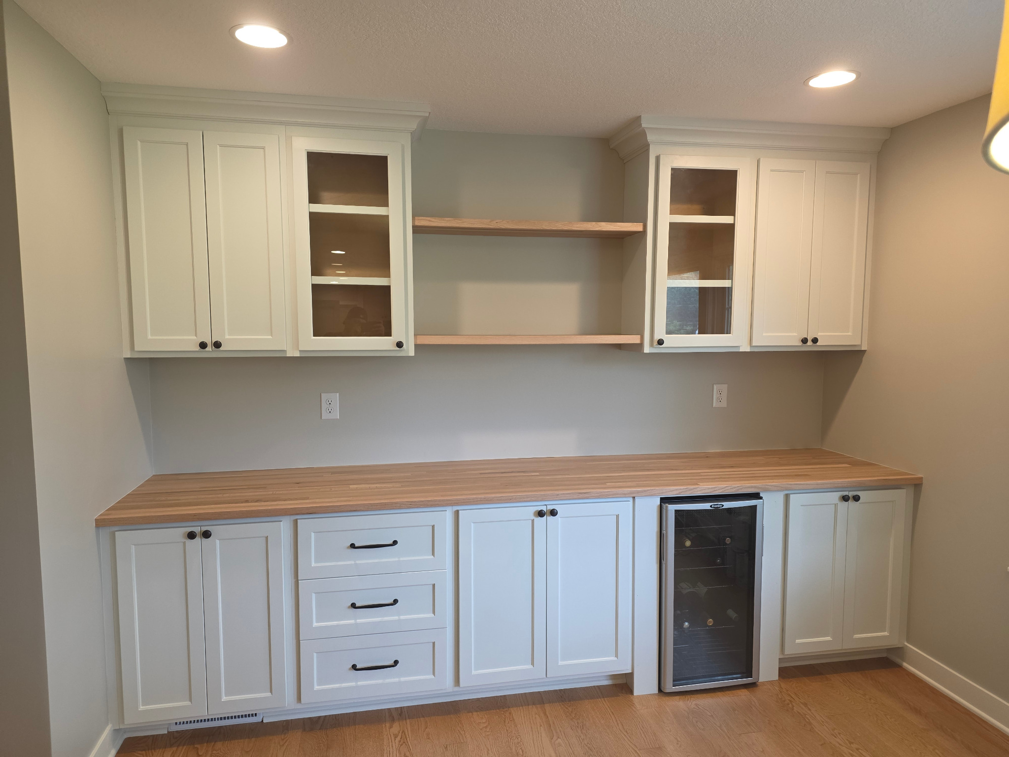 Custom white cabinetry and built-ins by Schleifer's WoodWorks