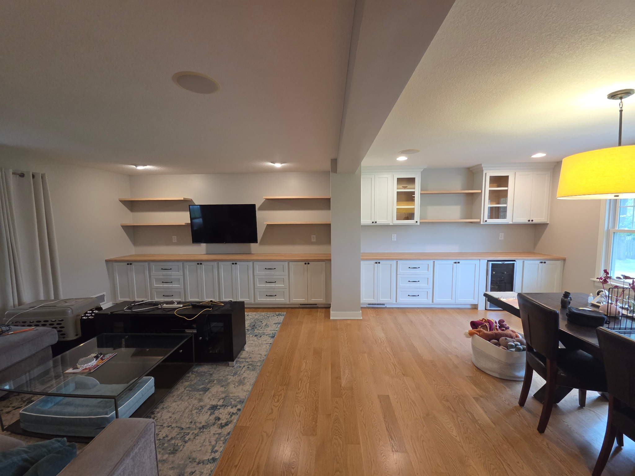 Custom built-in cabinetry across living and dining areas
